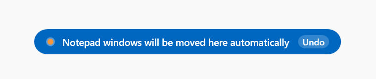 Confirmation toast saying that Notepad windows will be moved here automatically, with an Undo button.